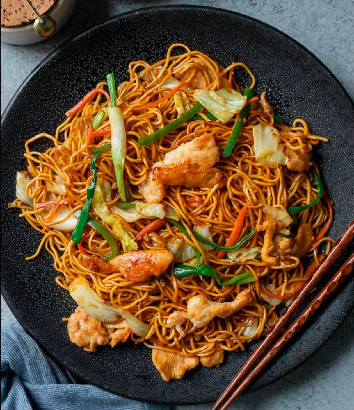Chicken Noodles — Stir-fried noodles with chicken, cabbage, carrot and spring onion, Indo-Chinese style.