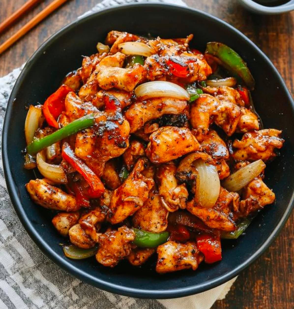 Chicken 65 — Crisp-fried chicken tossed with curry leaf, dried chilli and spring onion, South Indian style.