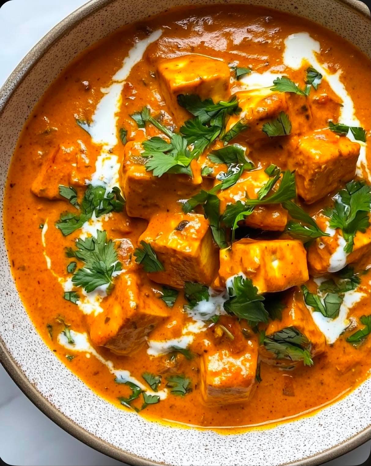 Paneer Butter Masala — Fresh cottage cheese cooked in a buttery tomato gravy with cashew nuts.