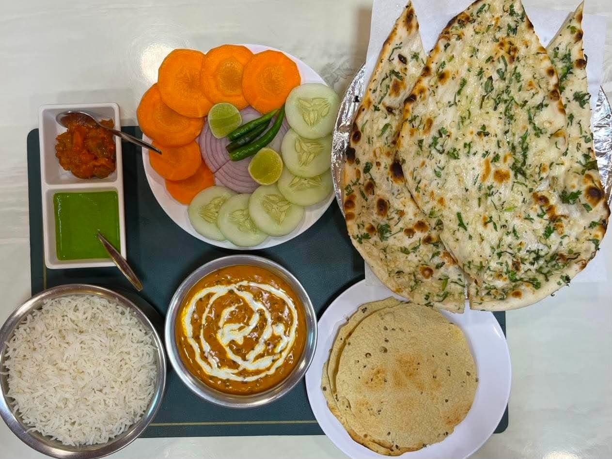 Naan, dal makhani, rice and fresh salad