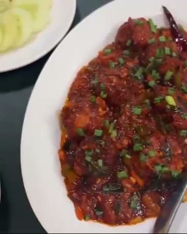 Chilli paneer stir-fried with peppers and onion
