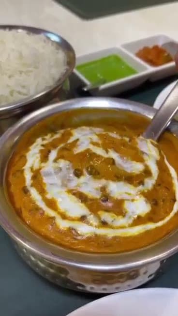 Dal makhani finished with a swirl of cream